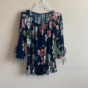 Women’s navy and floral top with 3/4 sleeve. No tag but looks to be a size S